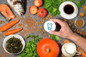 Superfoods for healthy teeth and gums like apple, nuts, veggies, fish