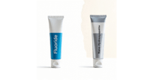 A product shot of two tubes of toothpaste: one with fluoride, one with nano-hydroxyapatite.