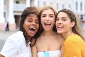 Diverse group of people with healthy, happy smiles achieved through modern oral care like nano-hydroxyapatite toothpaste.