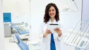 dentist smiling confidently after using coconut oil as coconut oil whiten teeth naturally 