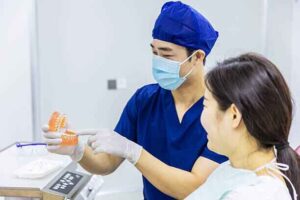 A dentist explains proper oral hygiene techniques.