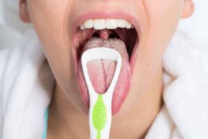 get rid of bad breath naturally by cleaning the tongue