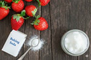 3 simple kitchen ingredients to whiten teeth naturally: baking soda, coconut oil, strawberries